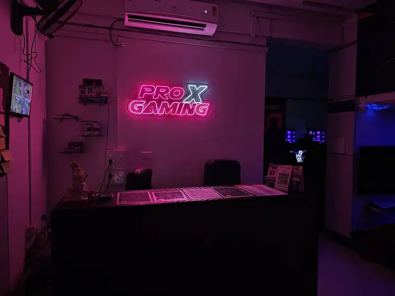 Close-up of the Pro X Gaming neon sign above the counter