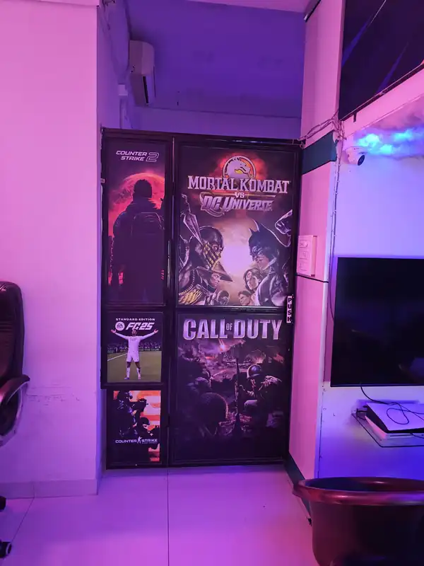 Door covered in game posters including Mortal Kombat, Call of Duty and EA FC 25