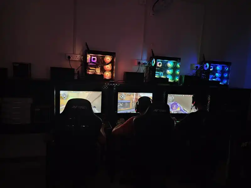Row of gaming PCs with RGB-lit cases at Pro X Gaming
