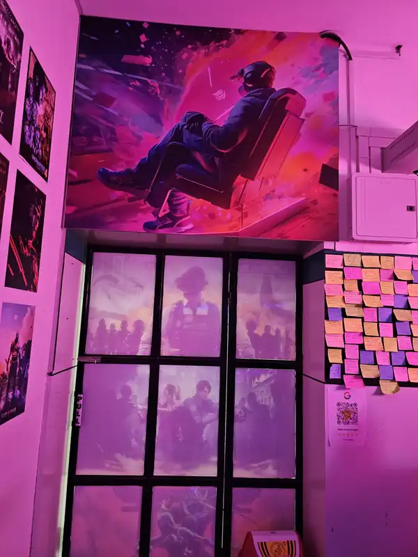 Cafe wall with a gaming poster and sticky notes left by customers